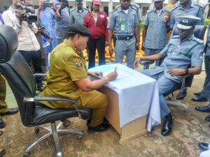 Kwara Area Controller of Customs, Compt. Faith Ojeifo (right), and Kwara NDLEA Commander, Hajiya Fatima Popoola, during the handing-over of the cannabis to the NDLEA.